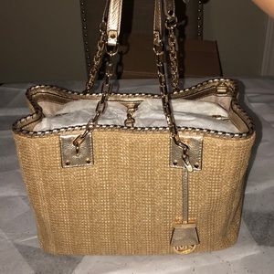Micheal Kors leather and straw woven satchel.